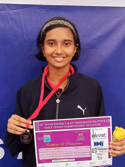 Anvi Thorat with her bronze medal from the U-15 girls' doubles event at the Maharashtra State Championship, contributing to our academy's strong doubles performance.