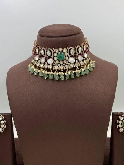 A close-up of our versatile floral stud earrings. These are available in multiple colors like emerald green and ruby red, and can be paired with many different necklaces.