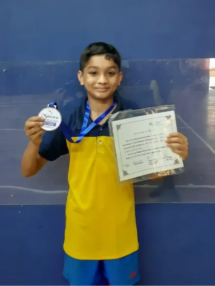 Liam Pais of our WCG centre with his silver medal from the Manora Subjunior Badminton Tournament held at Khar Gymkhana.