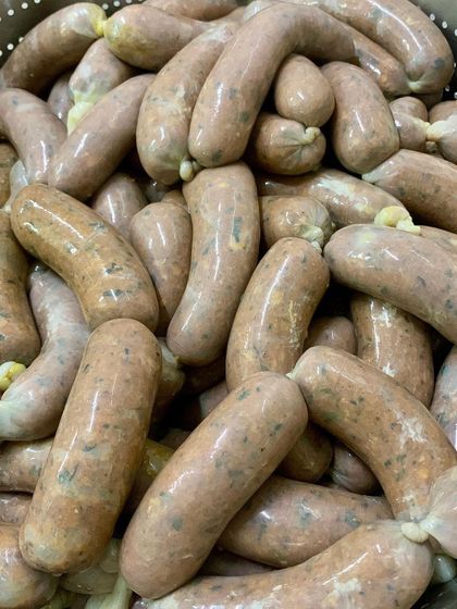 A fresh batch of our special pork and oyster mushroom sausages. We created these to celebrate our love for 'kummu' (mushroom), combining the earthy, umami flavor of mushrooms with our juicy pork mince.