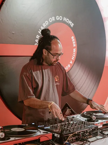 It's all in the details. Here I am deep in the mix during a 'City Goes Wax' vinyl set. This is for the analog heads who appreciate the warm sound and hands-on craft of a true vinyl DJ experience.