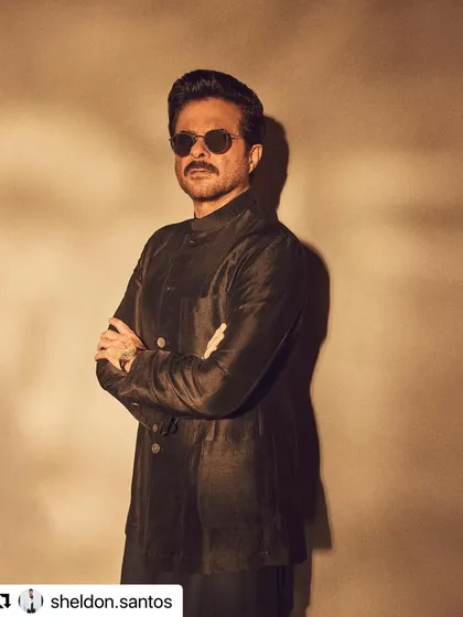 A classic, confident pose from Anil Kapoor, with his hair styled to perfection.