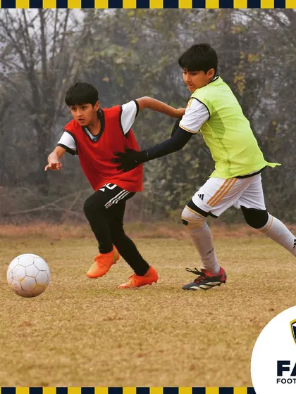 Two of our players in a competitive training match, showing the intensity we maintain even during practice.