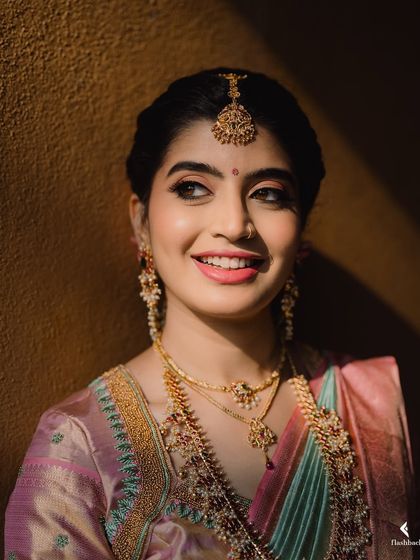 This close-up of Nidhi shows just how radiant and skin-like airbrush makeup can be. Her happiness truly completes the look.