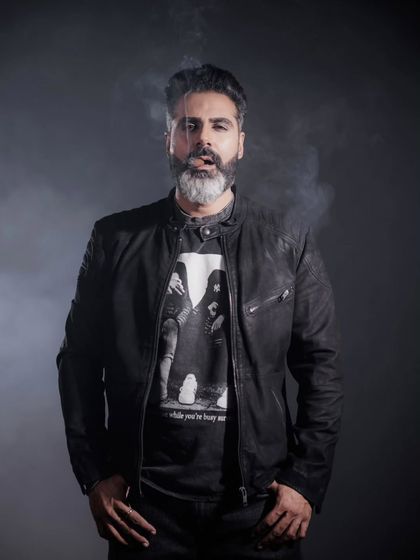 This colour portrait adds another layer to the series. The smoke was used as a visual element to add texture and mood, complementing the rugged look of the leather jacket for a striking editorial photograph.