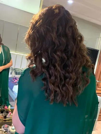 For a more relaxed, contemporary vibe, I create soft beachy waves that add volume and movement. This is a great option for a cocktail party or reception.