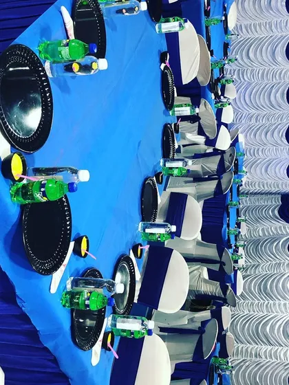 A clean and simple table setup with a blue and white theme. We can customize the decor and color palette to match the specific requirements of your event.