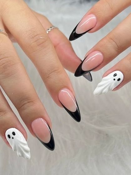 These ghosts came to slay, not scare. A fun and spooky Halloween set featuring classic black French tips and accent nails with cute, 3D sculpted ghosts.