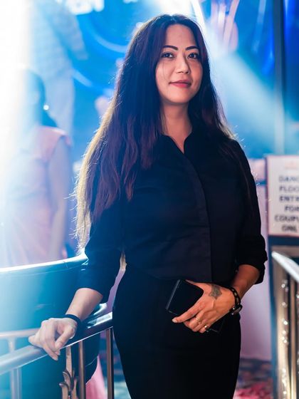 A guest posing by the dance floor entrance.