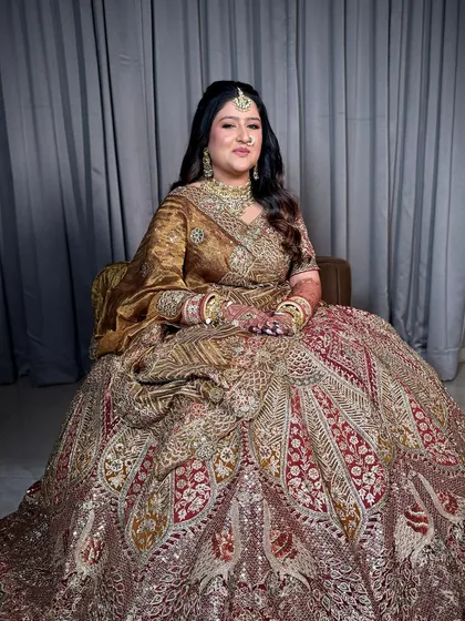 Another full-length view, showing how the makeup and outfit come together to create a truly regal bridal look.