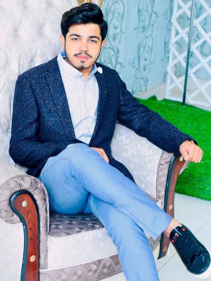 A stylish groom ready for his engagement. The grooming is subtle, focusing on enhancing his natural features to make him look his best.