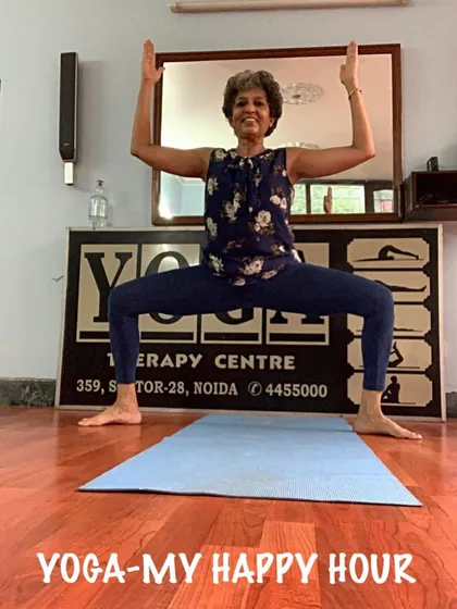 A smiling Goddess Pose. I encourage students to find their power and embrace the strength this asana builds.