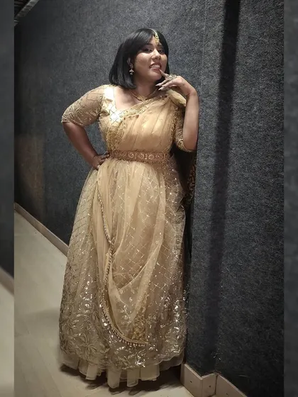 Posing in the golden lehenga. I love how traditional wear adds so much grace and elegance to an event.