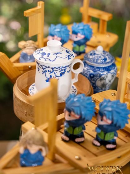 We believe in playful presentation. Here, our Asian-themed decor with fun ninja figurines adds a whimsical touch to the Teppan-yaki station, making it even more engaging for guests.