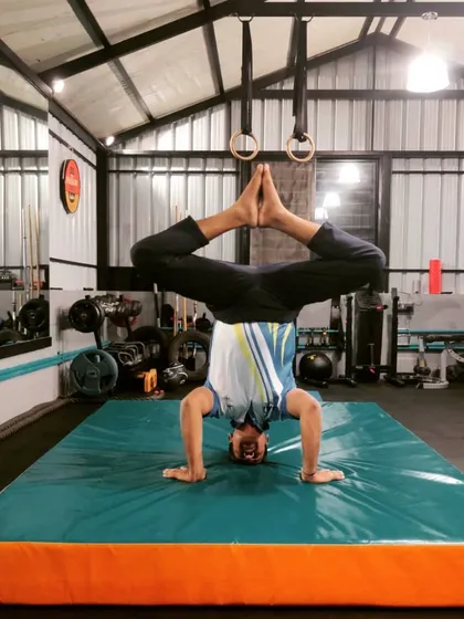 This headstand with legs in a diamond shape is another great pose for practicing balance and control. It also provides a good stretch for the hips.