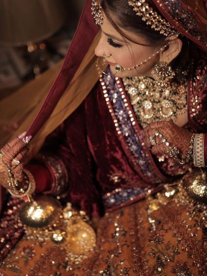 Our gorgeous bride Anisha in a multi-toned velvet lehenga, looking stunning in our heavy bridal jewellery.