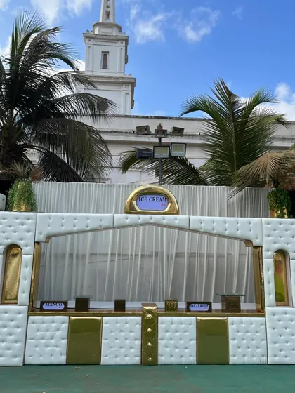 My elegant white and gold ice cream counter, designed to blend seamlessly with a sophisticated daytime wedding theme.