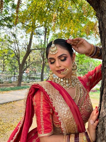 A beautiful outdoor shoot with our rani pink lehenga. The natural light brings out the richness of the color, making it ideal for a day wedding portfolio.