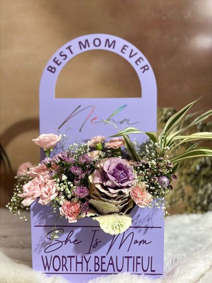 A frontal view of the "Lavender Bloom Handbag," showing the custom engraving and the beautiful mix of flowers. It's a gift that is both a stylish statement and a token of love.