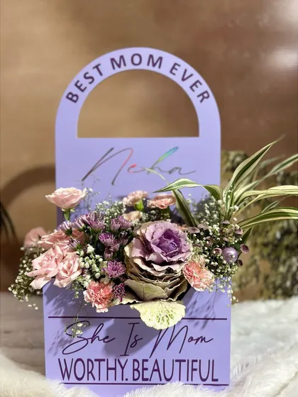 A frontal view of the "Lavender Bloom Handbag," showing the custom engraving and the beautiful mix of flowers. It's a gift that is both a stylish statement and a token of love.