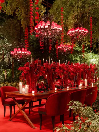 Inspired by the timeless beauty of heritage palaces, the 'Laal Bagh' reception was a study in moody luxury. The deep red palette, whimsical florals, and dramatic chandeliers came together to create a magical, immersive dining experience.