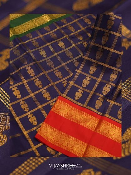 The body of the saree features checks with the mythical two-headed Gandaberunda bird, a symbol of strength.