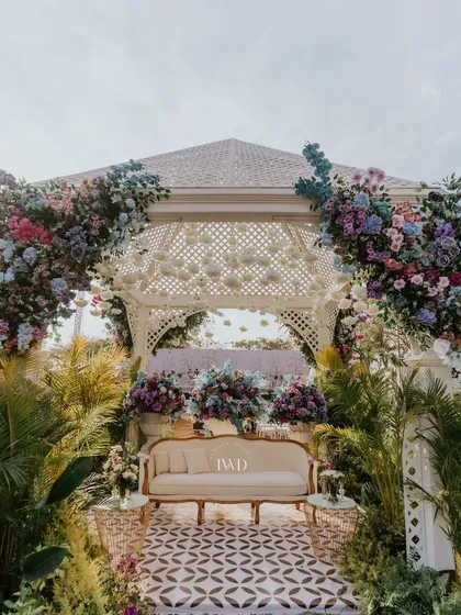 A beautiful gazebo seating area from the Bridgerton-themed event, adorned with pastel hydrangeas and surrounded by lush greenery. Perfect for a sophisticated garden party.