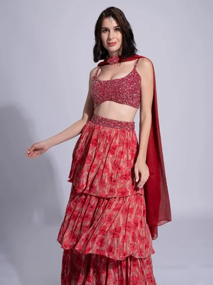 A beautiful look in red for Label Shivani Nirupam. The makeup is warm and radiant, with a soft red lip.