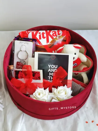Inside the red velvet box, you'll find a teddy bear, keychain, chocolates, and personalized message cards.