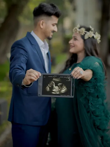 Sharing the first glimpse of your baby. Using the sonogram picture in your couple's shoot is a beautiful way to include your little one in the story.