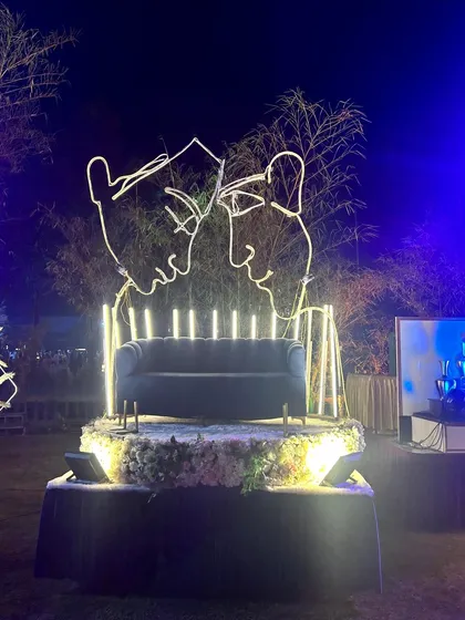 A unique photo spot for the Sangeet, featuring a neon-light outline of a couple, creating a romantic and modern art piece.