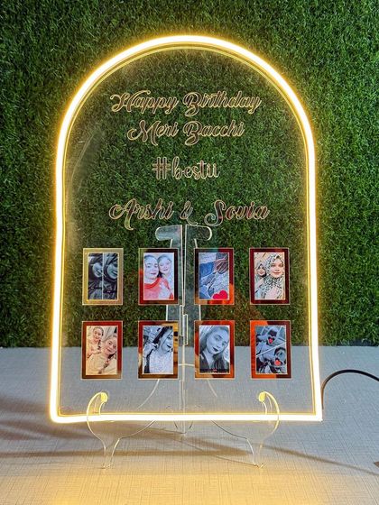 Make a statement with this personalized neon sign. It features an arch design with your custom quote in 3D letters and space to hang eight of your favorite mini photos.