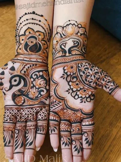 A bold and modern take on traditional motifs. This design uses negative space to highlight large peacock and floral elements, creating a striking and contemporary feel.