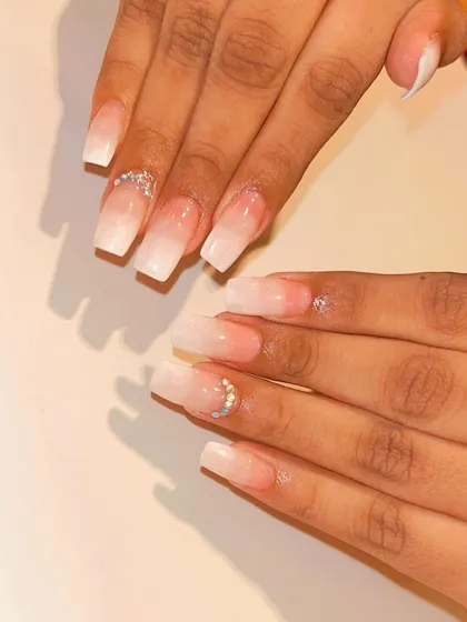 A classic baby boomer or ombre French nail set in a sharp coffin shape. The tiny rhinestone details at the cuticle add a subtle touch of wedding day sparkle.