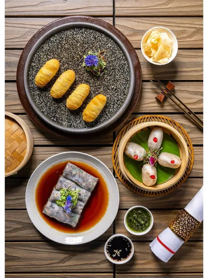 A collection of vegetarian dim sum, including Cheung Fun and fried rolls, arranged for the Shang Palace menu to showcase their diverse vegetarian offerings.