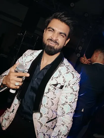 Here's me in my element, capturing the playful energy of a Sangeet night. It's not just about hosting the party, it's about living it, feeling the music, and sharing that joy with everyone on the dance floor. This is the vibe I bring.