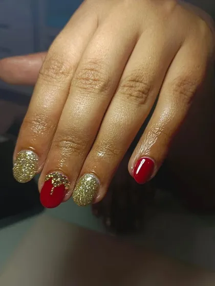 Red, wine, and gold are a match made in heaven for bridal nails. This design combines rich red with gold glitter and foil for a truly royal feel.