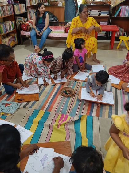 A duplicate of image 17, reinforcing the focus and engagement during craft time.