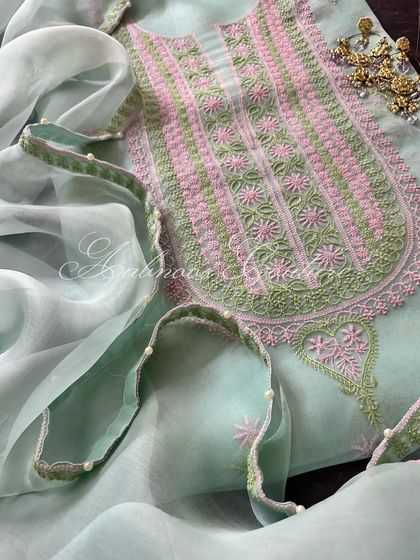 A close-up of the neckline and the pearl-adorned dupatta.