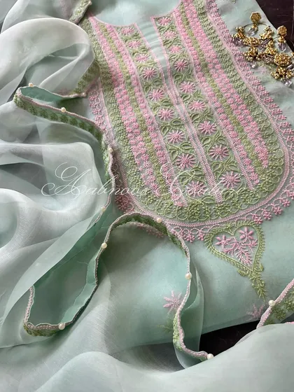 A close-up of the neckline and the pearl-adorned dupatta.