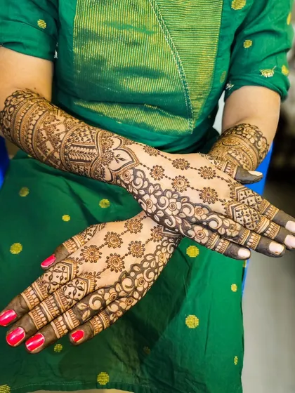 A crossed-hands pose to display the full design.