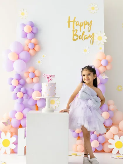 A full view of the lovely daisy-themed setup for this fifth birthday celebration. I love bringing a child's vision to life for their special milestone shoot.