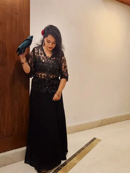 A different pose in the same lace outfit, showing a moment of quiet reflection. Your style should make you feel comfortable and poised in any situation.