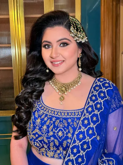 Sufi night enchantment. Arushi shines bright with gold shimmery eyes, a pink pout, and bold blue kohl for a stunning engagement look.