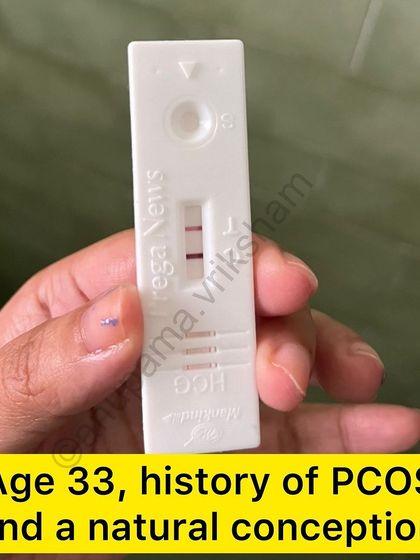 A positive pregnancy test from a 33-year-old with a history of PCOS who conceived naturally through regular exercise and a positive mindset.