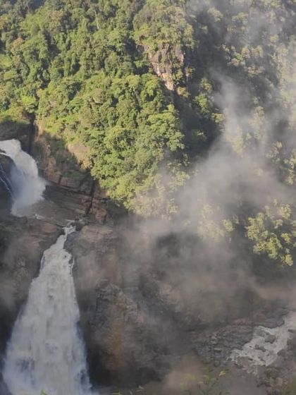 A misty, atmospheric view of Magodu Falls during the monsoon. Our Yallapura trip covers several such breathtaking waterfalls.