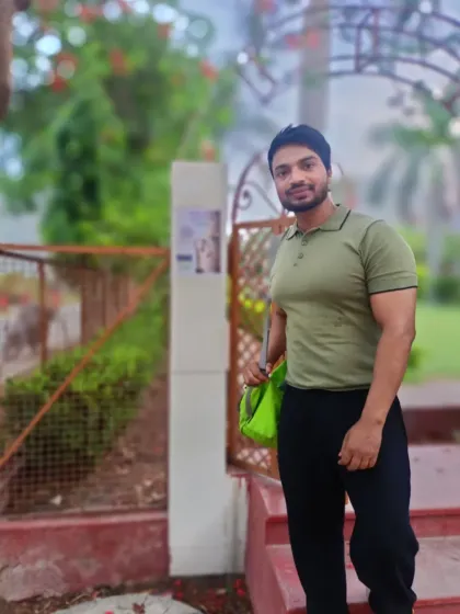 At the entrance of a park for a society fitness event. I enjoy bringing fitness to the community.