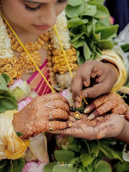 The sanctity of tradition is in the details. This close-up of the mangalsutra ritual captures the profound cultural and emotional weight of a single, significant moment.