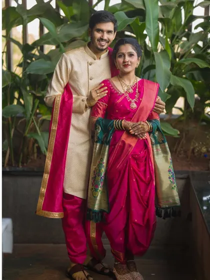 A full-length portrait displaying the grace of a traditional Nauwari saree. This pose captures the elegance and cultural pride of the couple's chosen pre-wedding theme.