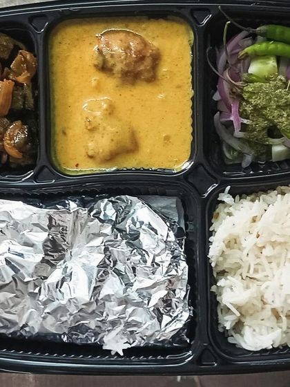 A delicious combination of bhindi sabzi and kadi pakoda. The crispy okra and the tangy yogurt curry make for a delightful meal.